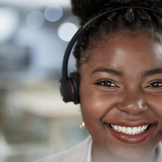 Im here to lend a listening ear. Shot of a young female call center agent working in an office.